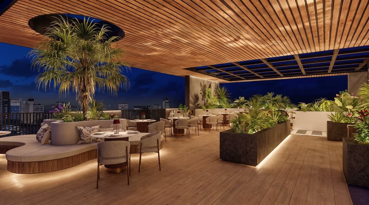 The Reserve rooftop dining at dusk, above the Gulberg III skyline